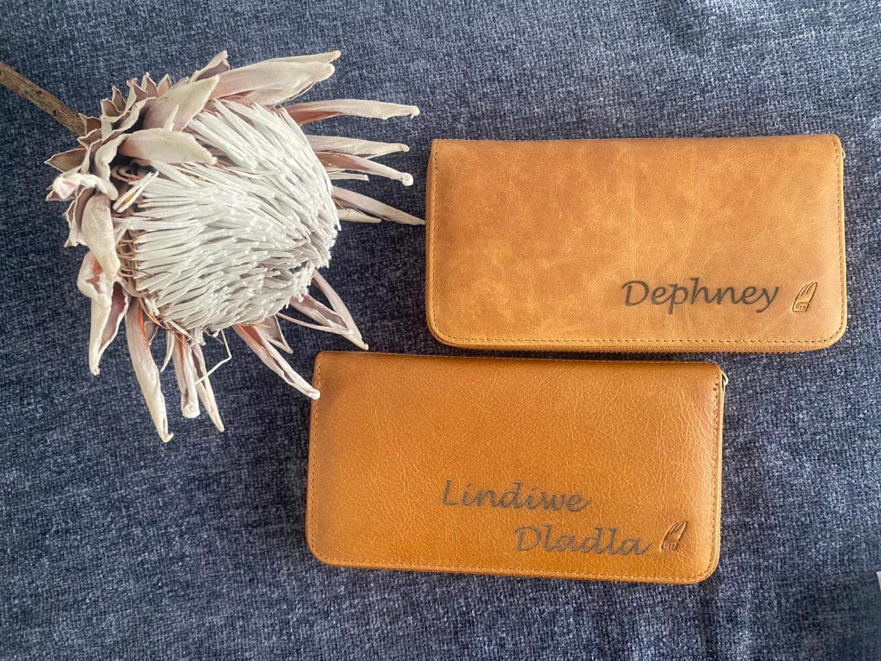 Custom laser-engraved wallet with personalized name and high-precision detail.