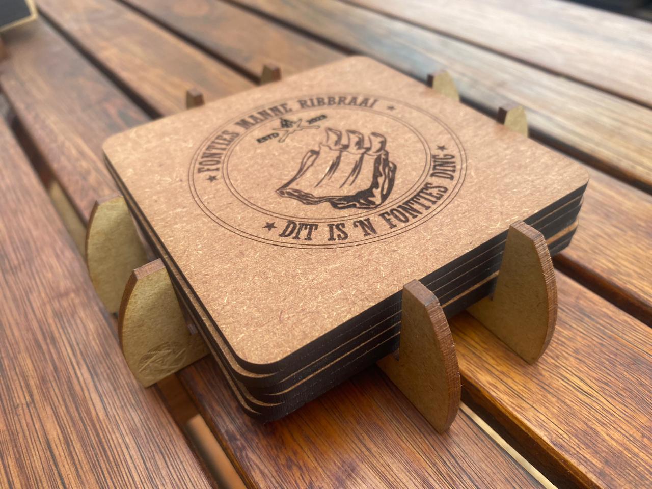 Set of premium laser-engraved coasters featuring intricate custom designs and heat-resistant finishes.