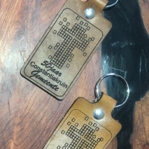 Custom laser-engraved premium leather keyring with personalized initials and a high-quality metal attachment.