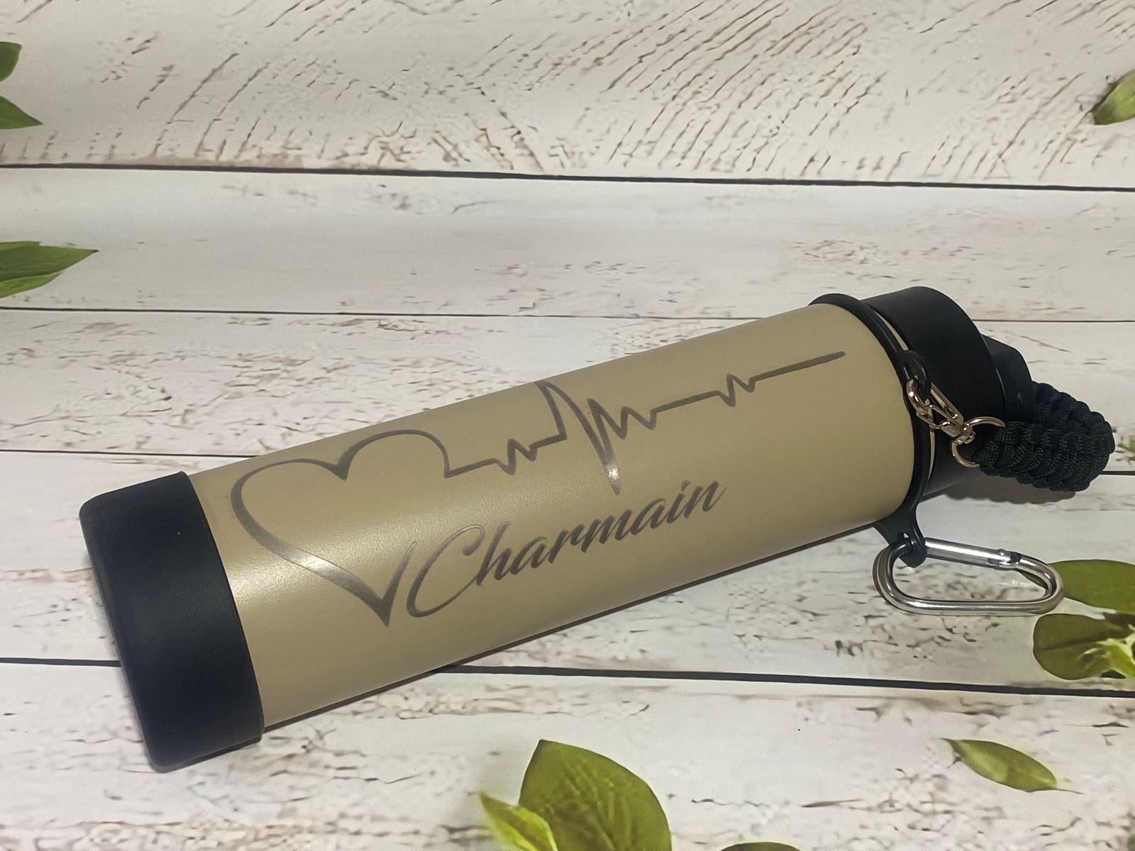 Laser-engraved 24oz (700ml) stainless steel rope bottle with a custom name and durable insulated finish.